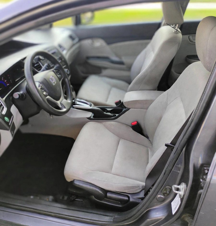 The front seats of the 2014 Honda Civic LX, clean and empty