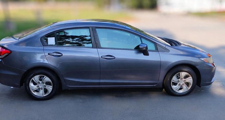 The 2014 Honda Civic LX that collects Price Guard Rideshare passengers